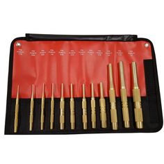 an assortment of brass screwdrivers in a black and red case on a white background