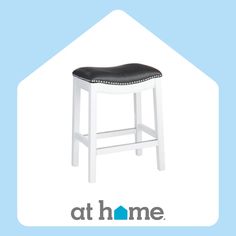 a white stool with black leather seat and the words at home on it's side