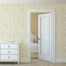 an open door to a bedroom with yellow and white wallpaper