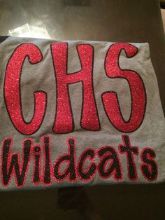 a gray shirt with red letters that says chs wildcats