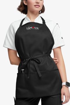 Keep more of you tidy with our bib apron. The neck strap adjusts for comfort. Ties at the waist let you perfect the fit there too. 3 front pockets keep essentials close and organized. Look like the professional you are with Chef Uniform. Timeless styles in comfortable, durable fabrics stay looking neat wash after wash • Protective bib style • Adjustable neck strap • Ties at the waist • 3 pockets • Measures 27”W x 24”L • Apron can be embroidered Designed for hard-working chefs, Chef Uniform makes Chef Uniforms, Butcher Apron, Bistro Apron, Restaurant Aprons, Staff Uniforms, Chef Wear, Shop Apron, Chef Uniform, Compression Wear