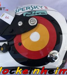 the helmet is designed to look like it has been painted with red, yellow and black circles