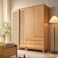 a bedroom scene with focus on the bed and wooden armoire in the foreground