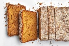 four slices of cake sitting next to each other on top of a white countertop