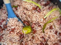 rice and beans are being cooked in a pan