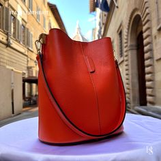 "This bag has been made of the best genuine leather by local master crafters of Florence in Italy, designed for women who only accept premium Italian quality and luxury leather bags and modern Italian fashion. . Size: Width: 27 cm / 10.75 inches Height: 19 cm / 7.50 inches Depth: 9 cm / 3.50 inches . The story of this bag : Once upon a time, in the charming city of Florence, Italy, renowned for its exquisite artistry and craftsmanship, there existed a small workshop tucked away in a cobblestone alley. This was the home of a gifted artisan named Alessio, whose passion for creating beauty out of leather was unparalleled. Alessio specialized in handcrafted leather goods, and his most prized creations were the leather clutch bags that exuded elegance and sophistication. The timeless charm of h High-end Everyday Pouch Bucket Bag, High-end Everyday Leather Bucket Bag, High-end Leather Bucket Bag, Luxury Bucket Shape Bag For Gift, Luxury Bucket-shape Shoulder Bag As Gift, Luxury Bucket Shape Shoulder Bag As Gift, High-end Textured Leather Shoulder Bag, High-end Everyday Textured Leather Shoulder Bag, Luxury Bucket Shoulder Bag As Gift