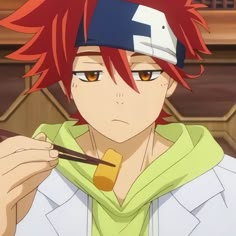 an anime character with red hair and orange eyes holding a chopstick in his hand