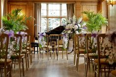 a room filled with lots of chairs covered in flowers