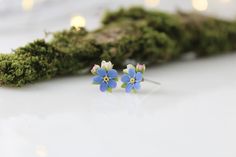 Forget me not stud earrings. Fairycore style earrings are a great gift for your loved one. Exquisite earrings with flowers of delicate blue forget-me-nots. Little stud earrings will be very popular with children. In my store you can buy a ring, necklace or hair pins with a cute bouquet of forget-me-nots ❀Flower size about 0.27in *0.27in Materials: - polymer clay - stainless steel ❤ flexible petals ❆ not afraid of the cold ☔ not afraid of water All my products you will receive in a gift box! ❀ Pl Delicate Blue Flower Shaped Earrings, Delicate Blue Flower-shaped Earrings, Whimsical Blue Flower Earrings For Gift, Whimsical Blue Flower Earrings, Dainty Blue Flower Earrings, Delicate Blue Flower Earrings, Delicate Blue Flower Earrings For Wedding, Dainty Blue Earrings For Wedding, Blue Dainty Hypoallergenic Flower Earrings