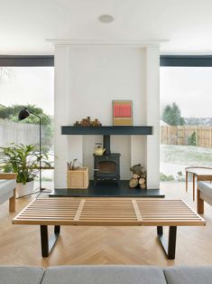 a living room with a fire place and couches