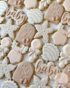 baby shower cookies are arranged on a table