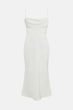 a white dress that is very short and has straps on the side, with an asymmetrical neckline