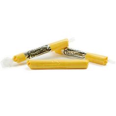 three yellow crayons sitting on top of each other