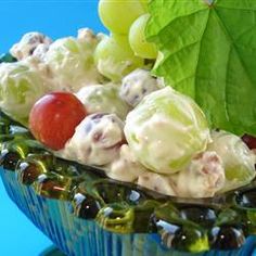 a bowl filled with grapes and other fruit