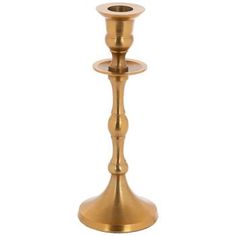 a gold candle holder on a white background