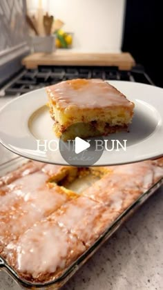 two pieces of cake sitting on top of a white plate in front of an oven