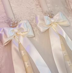 two wedding garters with bows on them