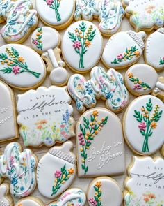 decorated cookies with flowers and writing on them