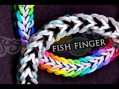 the fish finger bracelet is multicolored and has a black cord with white braiding