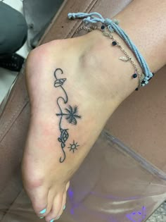 a woman's foot with a tattoo on it