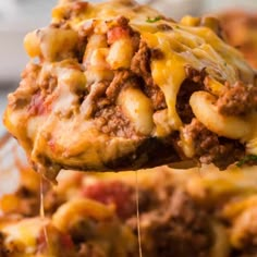 a spoon full of cheese and meat casserole