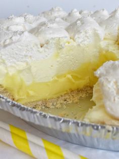 a pie sitting on top of a metal pan covered in white frosted toppings