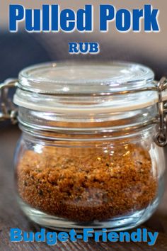 a glass jar filled with food sitting on top of a wooden table