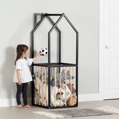 A storage unit for the playroom! Our playhouse storage tower is designed to fit in with the childlike decor of your room, but also to create a practical organizational space. Inside, you can store stuffed animals, dolls, large balls, and larger toys. Several wooden bars have been added all around to keep all your little one's toys in place. Another plus is that your children will be able to put away their own accessories once playtime is over. It's not just mom and dad who can put things away! A Scandinavian playroom tower playroom decor is often colorful, cheerful, and fun. We love its small house shape, its triangular roof, and its little chimney. This storage tower is made of real wood, which makes it very strong and safe. It was also entirely designed according to the current safety st Scandinavian Playroom, Store Stuffed Animals, Toy Storage Units, Boys Playroom, Toddler Playroom, Kids Playroom Decor, Toy Organizer, Playroom Organization, Stuffed Animal Storage