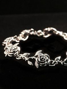 This detailed rose link bracelet comes in your choice of 8 Links ( 7.25" in length) or 9 Links (8.25" in length). Treat yourself or your special someone to this beautiful bouquet!This item usually ships the same or next business day.All Marty Magic Jewelry is packaged in a beautiful box, embossed with the gold foil Marty Magic dragon logo. Perfect for any occasion!Designed in Santa Cruz California by Marty Magic. Made in the U.S.A. Silver Rose Bracelet, Vintage Flower Bracelet, Rose Jewelry Flower, Tassel Anklet, Silver Flower Bracelet, Magic Jewelry, Fancy Bracelet, Dragon Logo, Magic Dragon