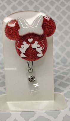 Our 2.5 inch badge reel is made with durable acrylic and features a durable velcro attachment to ensure a secure fit. The interchangeable option allows you to easily change or customize them to fit your style or season. Acrylic topper only You will only receive the acrylic design with an already attached velcro piece. This allows you to swap out your design if you have previously ordered a belt clip or alligator swivel. You will not receive a belt clip or alligator swivel reel. I make every  eff Mickey Badge Reel, Personalized Badge Reel For Valentine's Day Gift, Customizable Red Badge Reel As A Gift, Disney Badge Reels, Badge Reels Diy, Acrylic Topper, Pretty Pens, Badge Buddy, Glitter Tumbler Cups