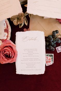 the wedding stationery is laid out on top of an envelope