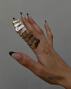 Spell it out in solid gold. While nameplates have no singular origin, much of the nameplate jewelry you see today stems from the iconic Fulton Street in Brooklyn during the 80s and 90s. Today, we pay homage to this legacy with a modern approach and bold, spirited design which we are honored + excited to share. This ring is made in 14k gold and is intentionally designed completely solid (no hollow rings here). With each ring weighing in around 9-12 grams, they boast a distinctive weight you can f Nameplate Ring, Historical Concepts, Hollow Ring, Hip Hop Culture, 14k Gold Ring, Jewelry Lookbook, Pure Gold, Traditional Jewelry, Name Plate