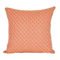 an orange and white pillow on a white background