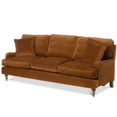 a brown couch sitting on top of a white floor