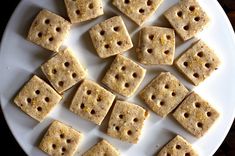 several pieces of crackers with holes in them