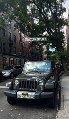 the jeep is parked on the side of the street