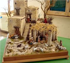 a nativity scene is displayed on a table