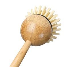 a close up of a wooden brush on a white background