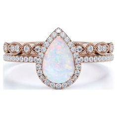 a white opal and diamond ring set