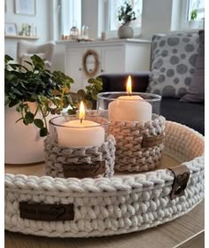 crocheted tray with three candles on it