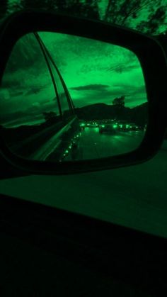 a rear view mirror reflecting the night sky