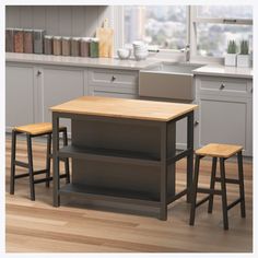 three stools and a table in a kitchen