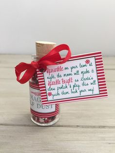 a jar filled with candy and a red ribbon