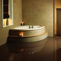 a bathroom with a large jacuzzi tub next to a window and radiator