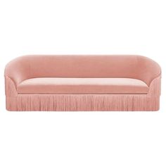 a pink couch with fringes on the arms and back, against a white background