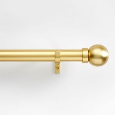 an image of a gold curtain rod