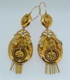 A lovely pair of Original Victorian-era earrings. These earrings date from the late 1800s. They are crafted from 14K Yellow and Rose Gold. The earrings are day and night, meaning you can adorn the ear with the button tops alone or add the massive body for a very dramatic look. These earrings instantly reminded me of lockets. The body is an oval shape with a gold fringe at the bottom. The fronts of the body are decorated with applied fine gold work in Rose Yellow and green gold. They are applied Pearl Fringe, Night Meaning, Victorian Earrings, Gold Fringe, Art Nouveau Jewelry, Gold Work, Rose Yellow, Day Night, Dream Jewelry