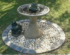 there is a small fountain in the yard