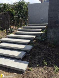 concrete steps leading up to the side of a building