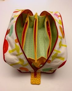 an open purse sitting on top of a white table